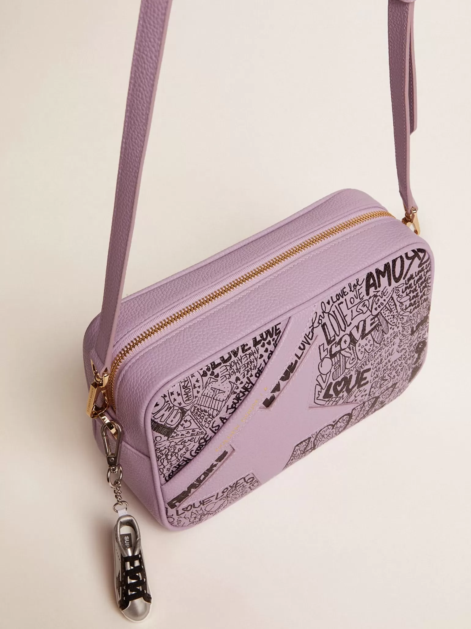 Clearance Bolsa Star de couro martelado lilás com estrela de couro tom sobre tom e estampa de grafite preto all-over MULHER Bolsas tiracolo