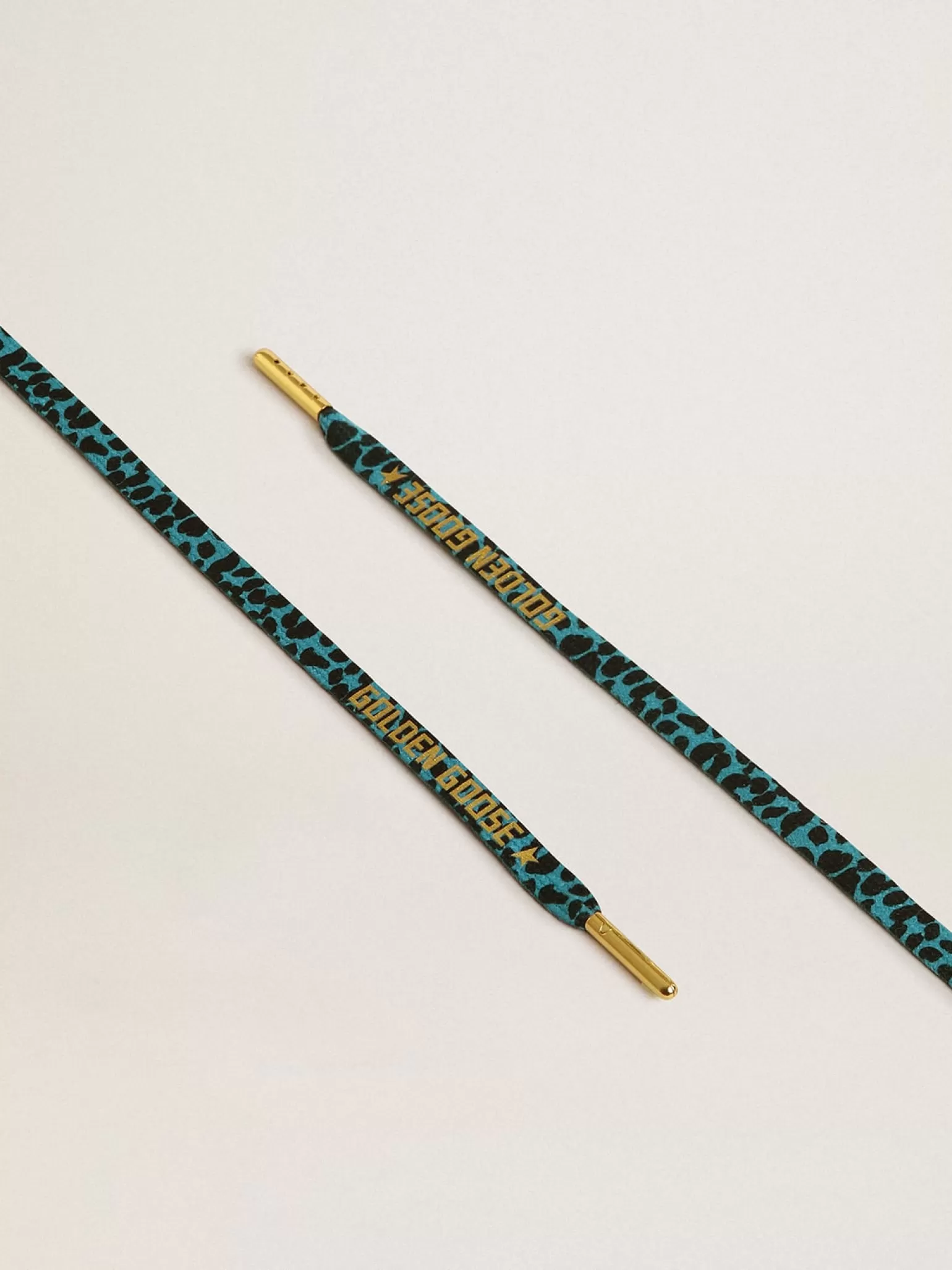Online Cadarços salpicados em azul e preto com logo dourado em contraste MULHER Cadarços | Cadarços