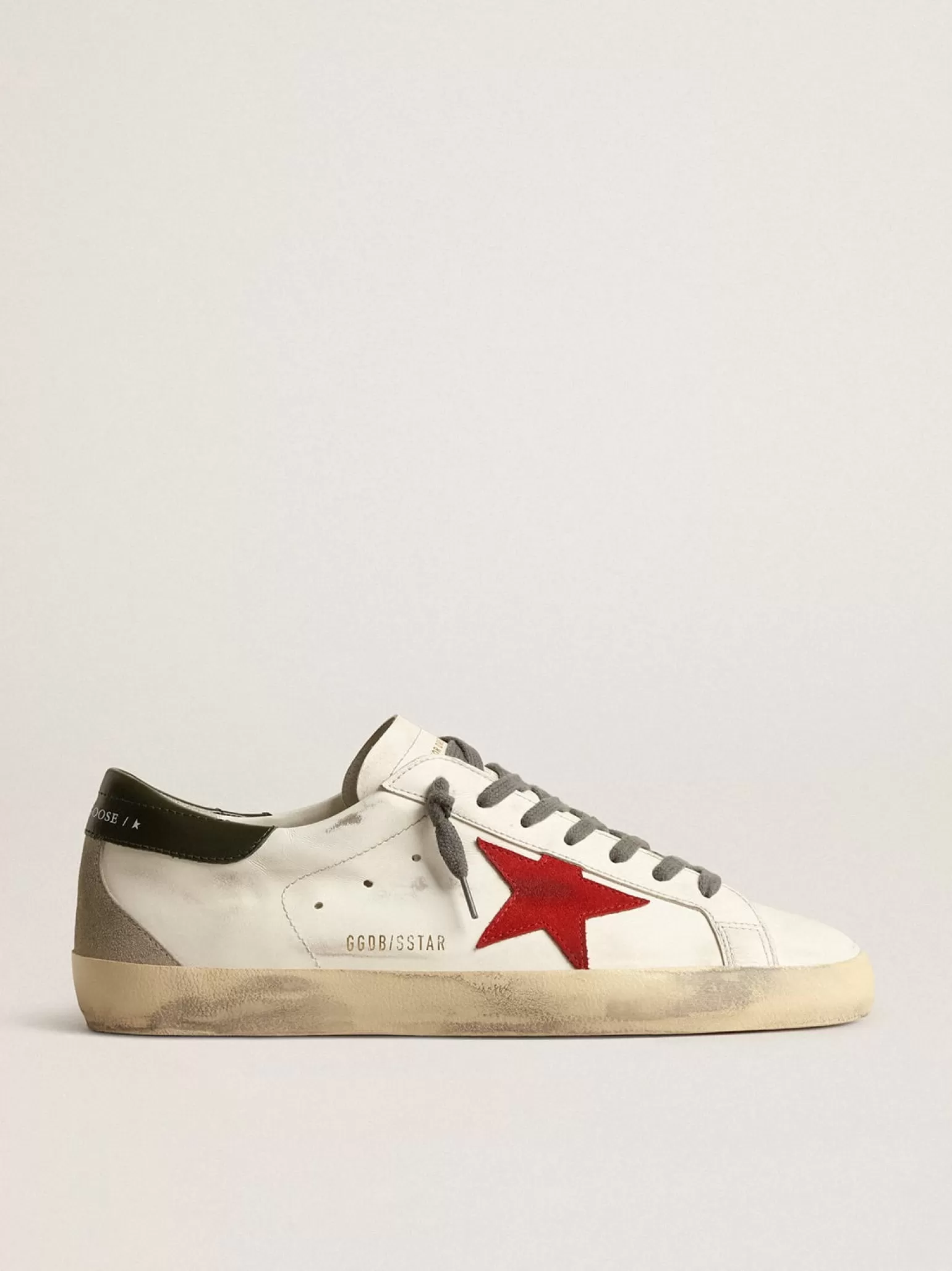 Store Super-Star com estrela de suede vermelho e talão de couro verde Super-Star